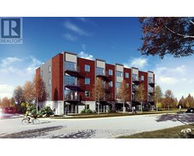 A modern apartment building with a bicycle parked in front.