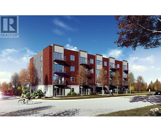 A modern apartment building with a bicycle parked in front.