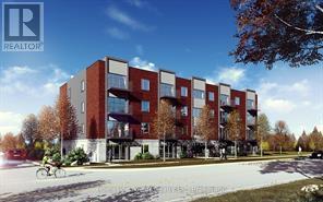 A modern apartment building with a bicycle parked in front.
