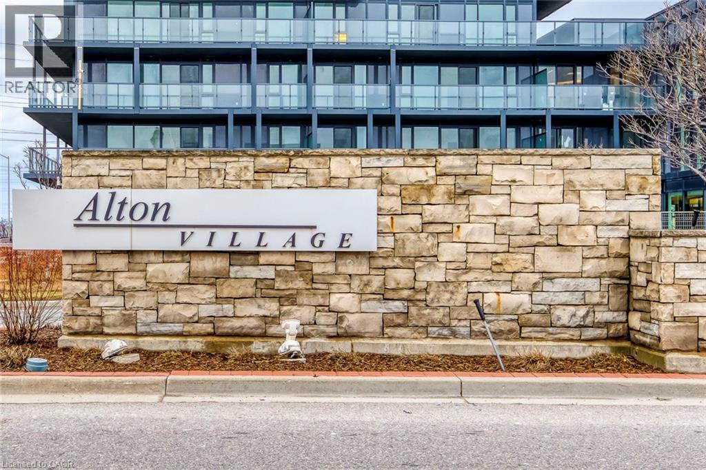 A sign that says Alton Village in front of a building.