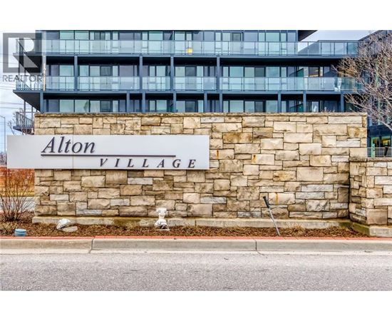 A sign that says Alton Village in front of a building.