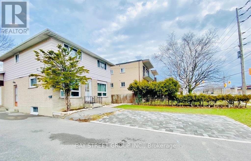 A real estate photo of a residential area with a Bay Street Group Inc. sign.