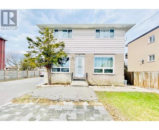 A real estate photo of a residential area with a Bay Street Group Inc. sign.