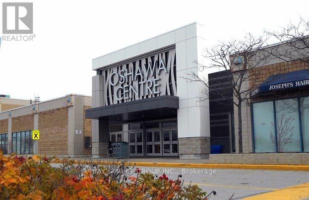 A building with a sign that says Yoshawa Centre.