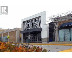 A building with a sign that says Yoshawa Centre.