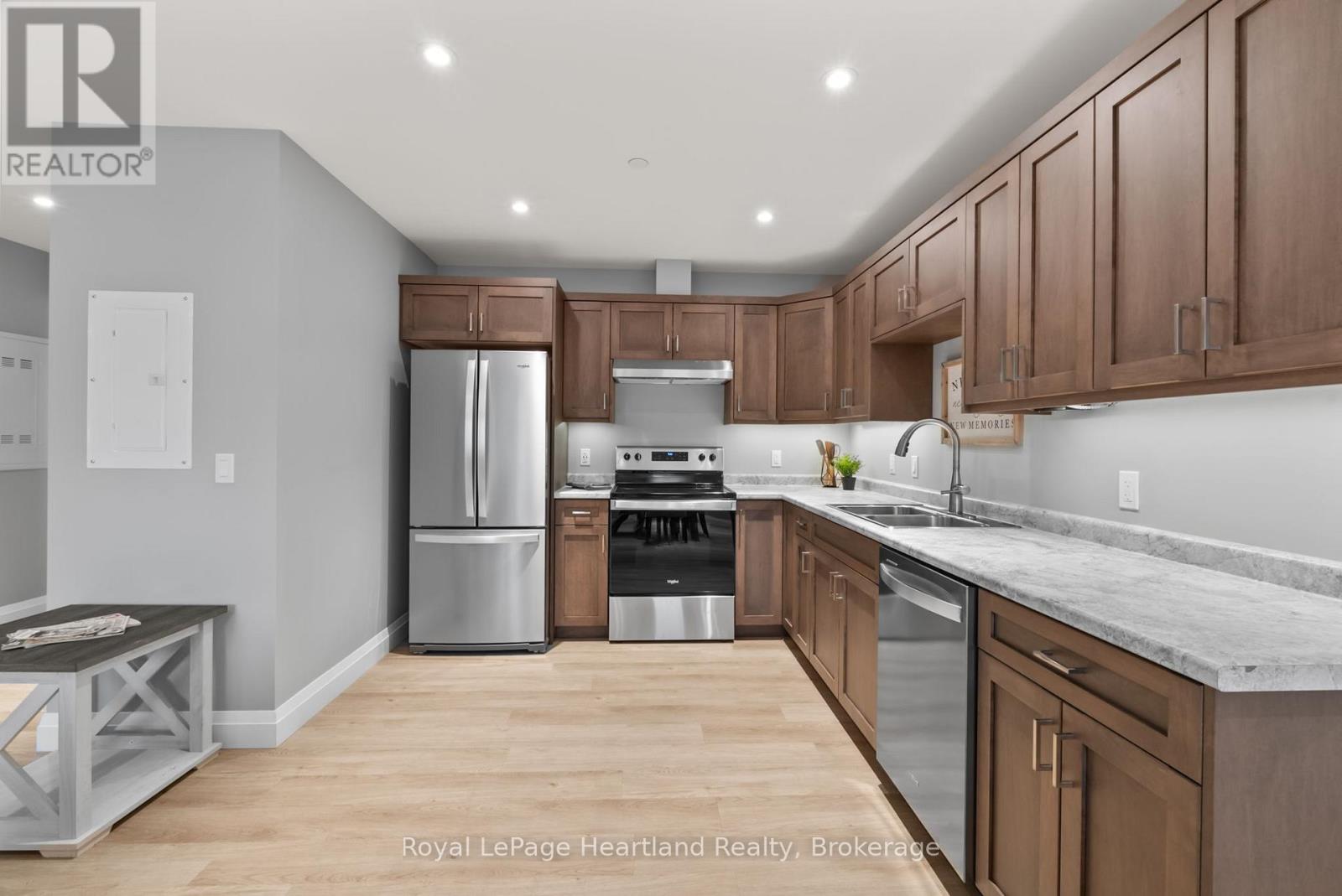 A kitchen with wooden cabinets and stainless steel appliances.