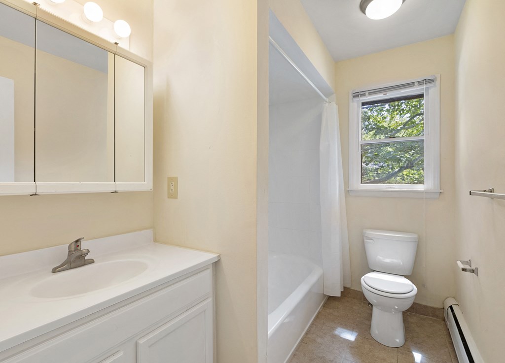 an empty bathroom with a toilet and a sink