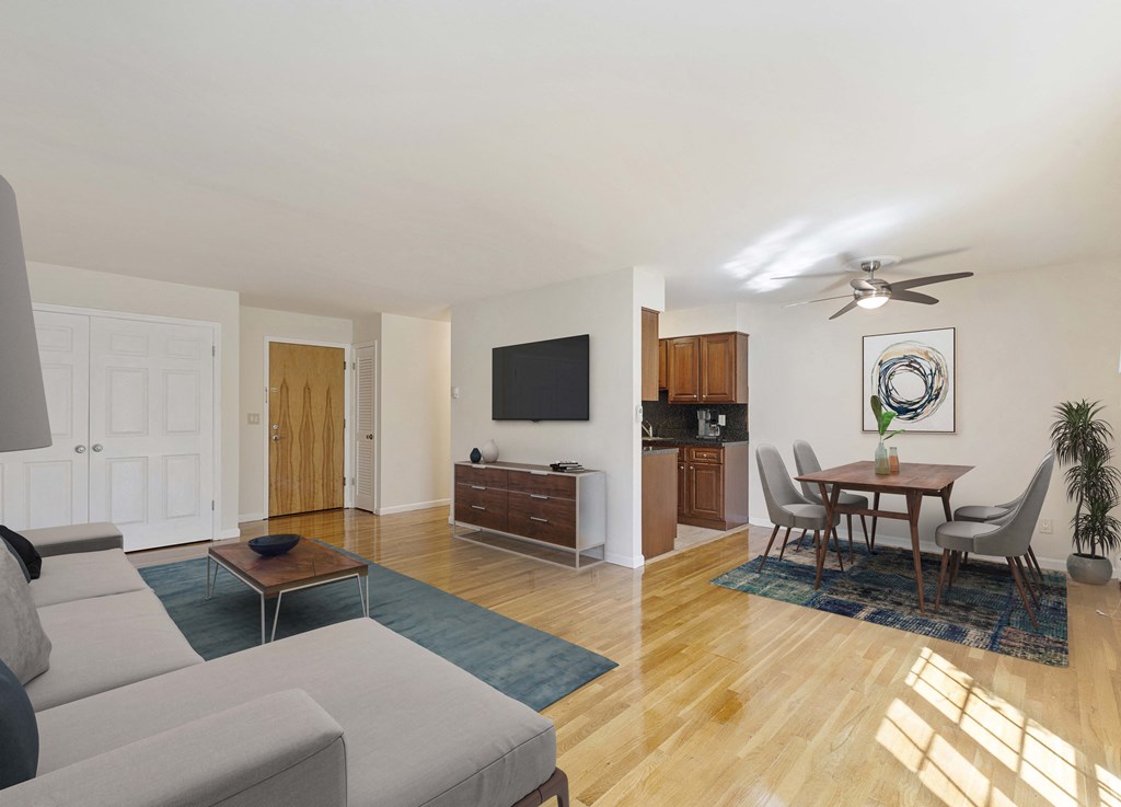 a living room and dining room with a couch and a table