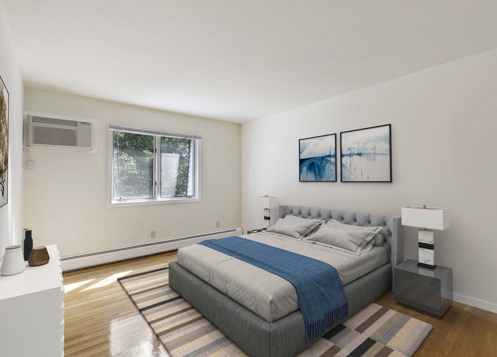 a bedroom with a bed and two windows