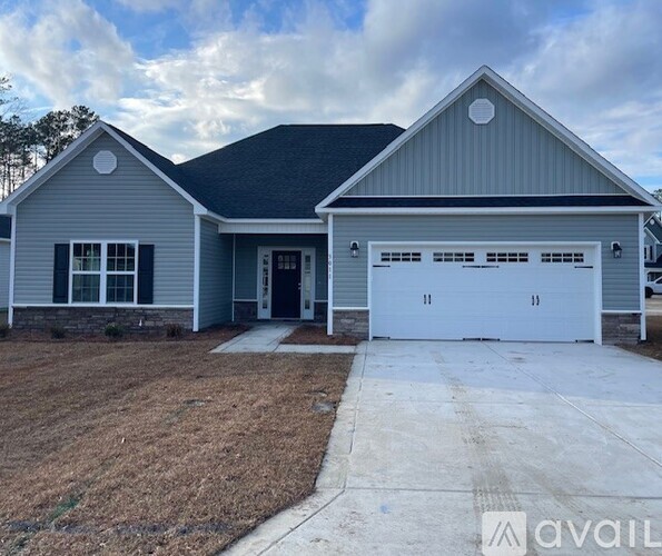 A two-car garage is attached to a house.