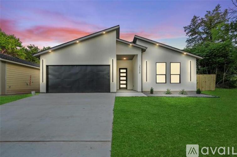 A modern house with a garage and a driveway.