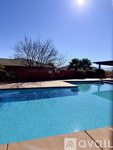 A pool with a sunny sky in the background.