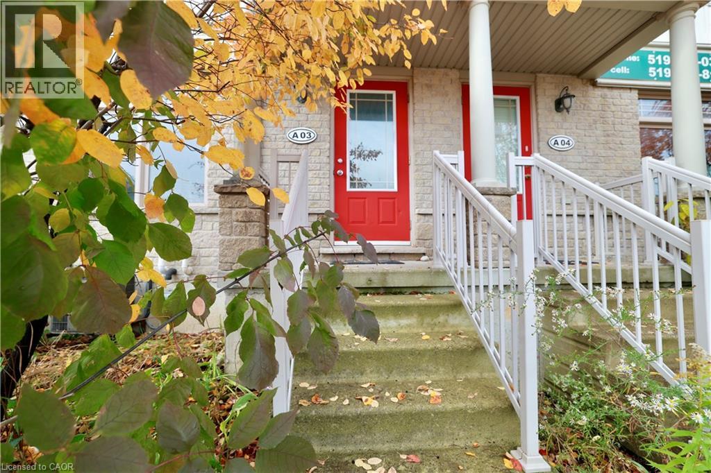 A house with a red door and a white railing.