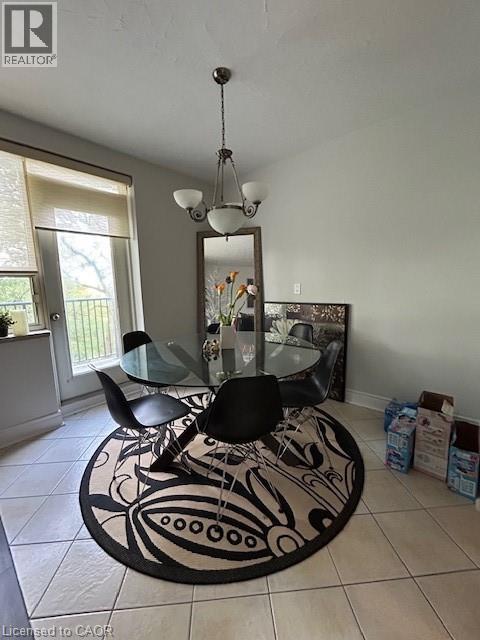 A dining room with a glass table and chairs.