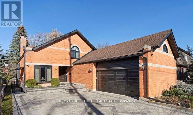 A house with a garage and a driveway is for sale.
