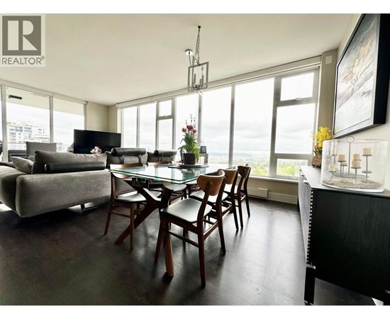 A dining room with a glass table and chairs.