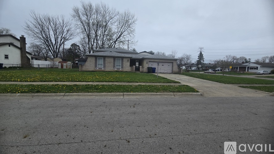 A house with a driveway in front of it.