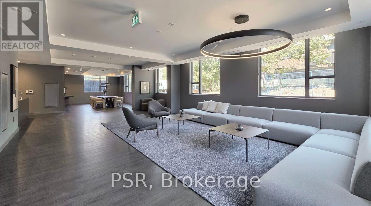 A modern living room with a large sofa and a coffee table.