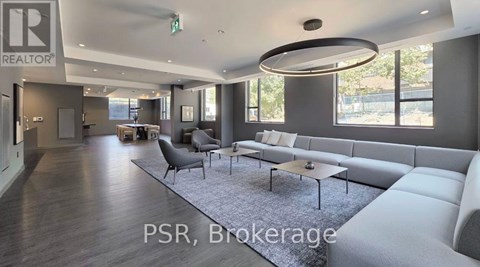 A modern living room with a large sofa and a coffee table.