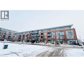 A large building with a lot of windows and a sign that says REALTOR.