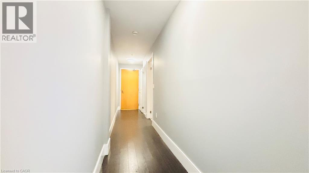 A long hallway with a door at the end.