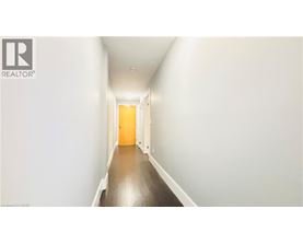 A long hallway with a door at the end.