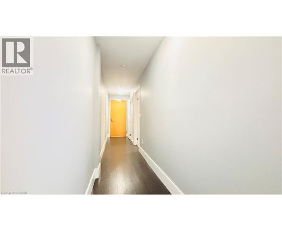 A long hallway with a door at the end.