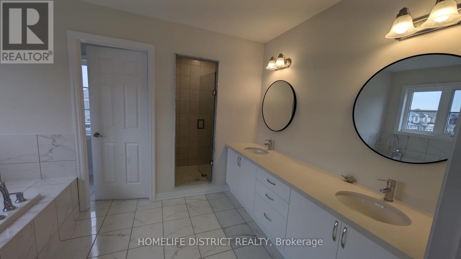 A bathroom with a sink, mirror, and toilet.