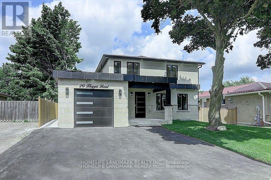 A two-story house with a garage is for sale.