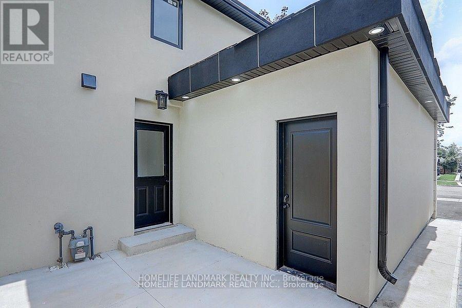 A house with a black door and a small window above it.