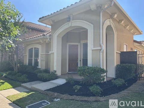 A house with a brown door and a window is for sale.
