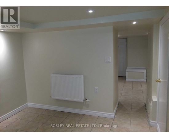 A room with a white radiator on the wall.