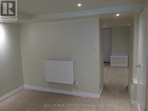 A room with a white radiator on the wall.