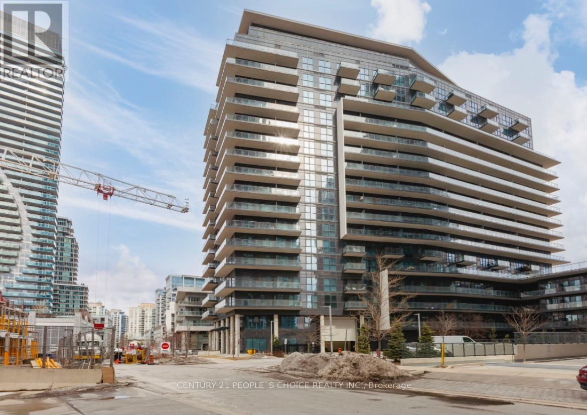 A large building under construction with a crane in the background.