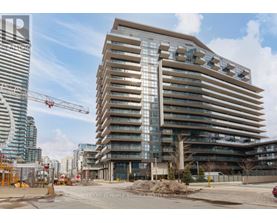 A large building under construction with a crane in the background.