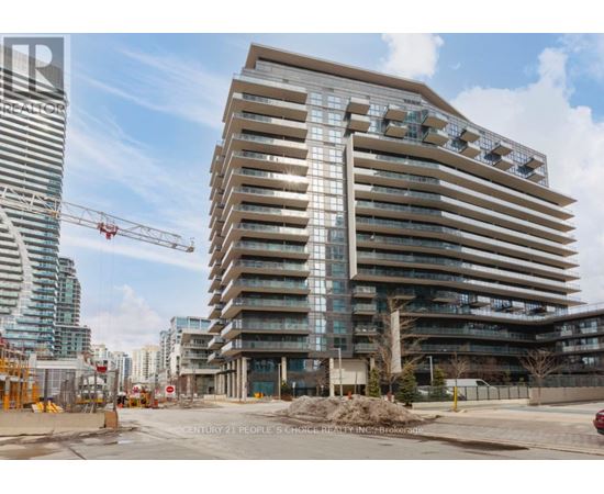 A large building under construction with a crane in the background.