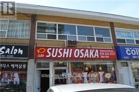 A building with a Sushi Osaka sign on the front.