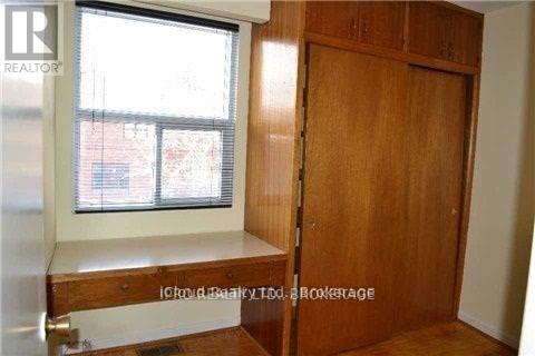 A brown wooden door is closed.