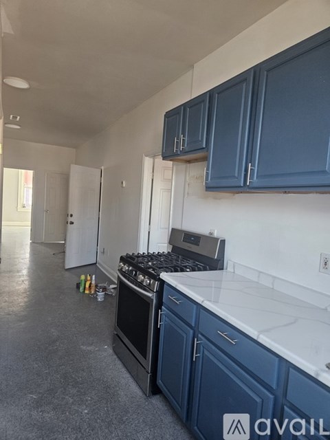 A kitchen with a stove and cabinets.