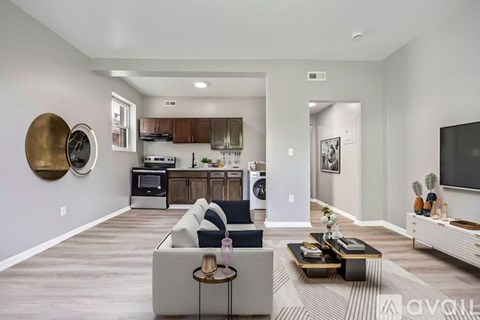 A modern living room with a grey sofa and a coffee table.