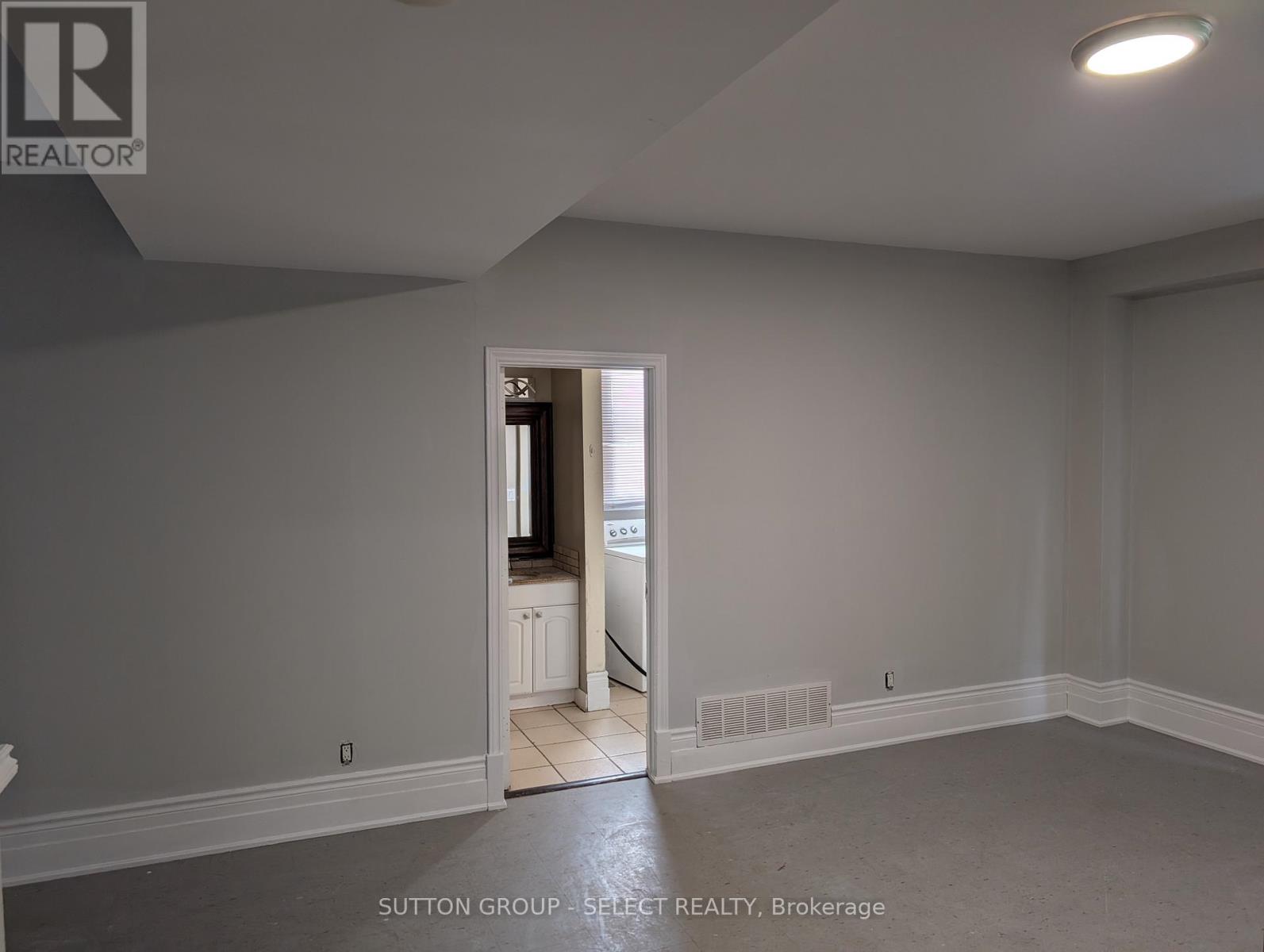 A room with a doorway leading to another room.