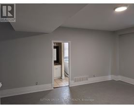 A room with a doorway leading to another room.