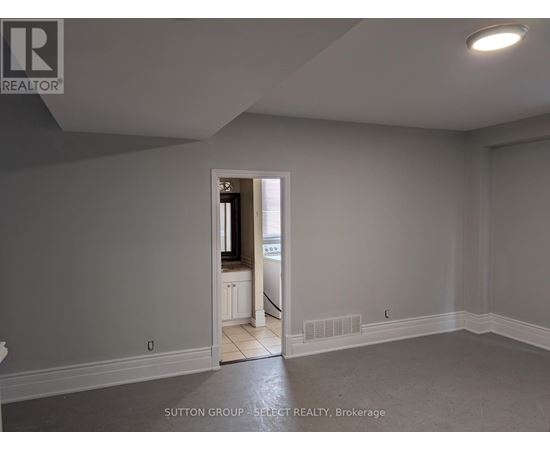 A room with a doorway leading to another room.