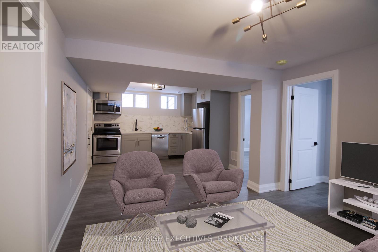 A living room with two chairs and a coffee table.