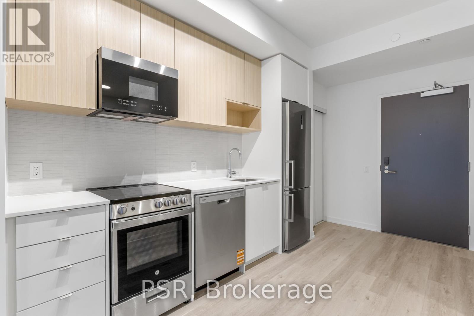 A kitchen with a stove top oven and microwave above it.
