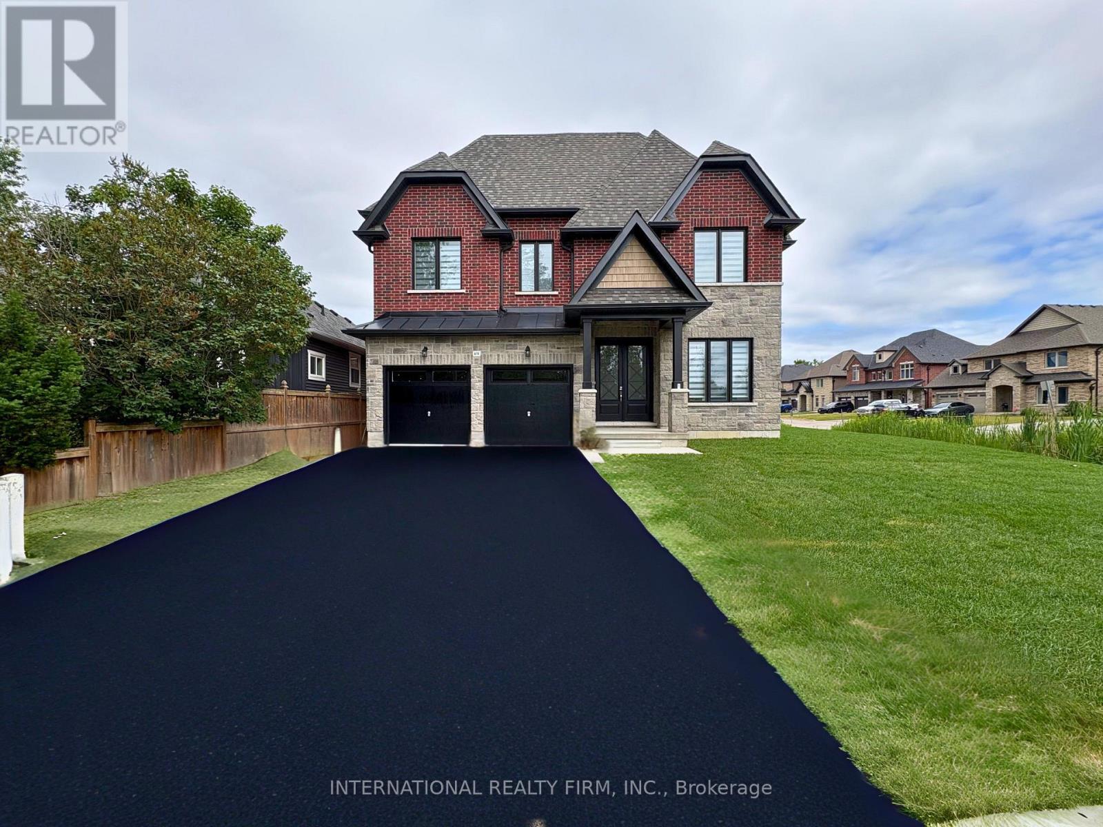 A house with a driveway in front of it.