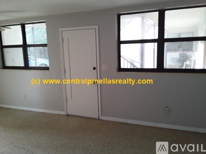 A room with a door and a window.