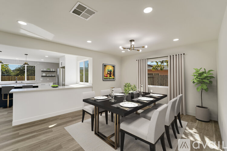 A modern dining room with a table set for six.