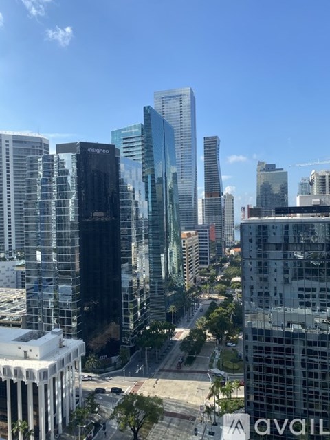 A cityscape with tall buildings and a clear sky.