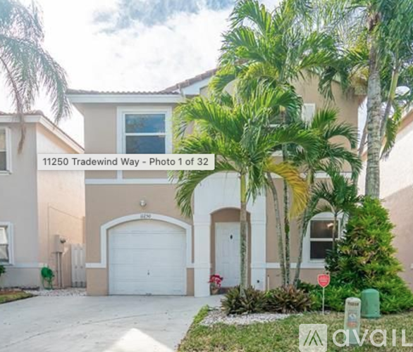 A house with the address 11250 Tradewind Way is shown in the image.